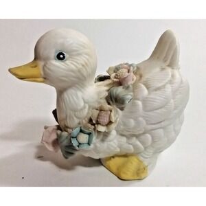 White Duckling wearing garland